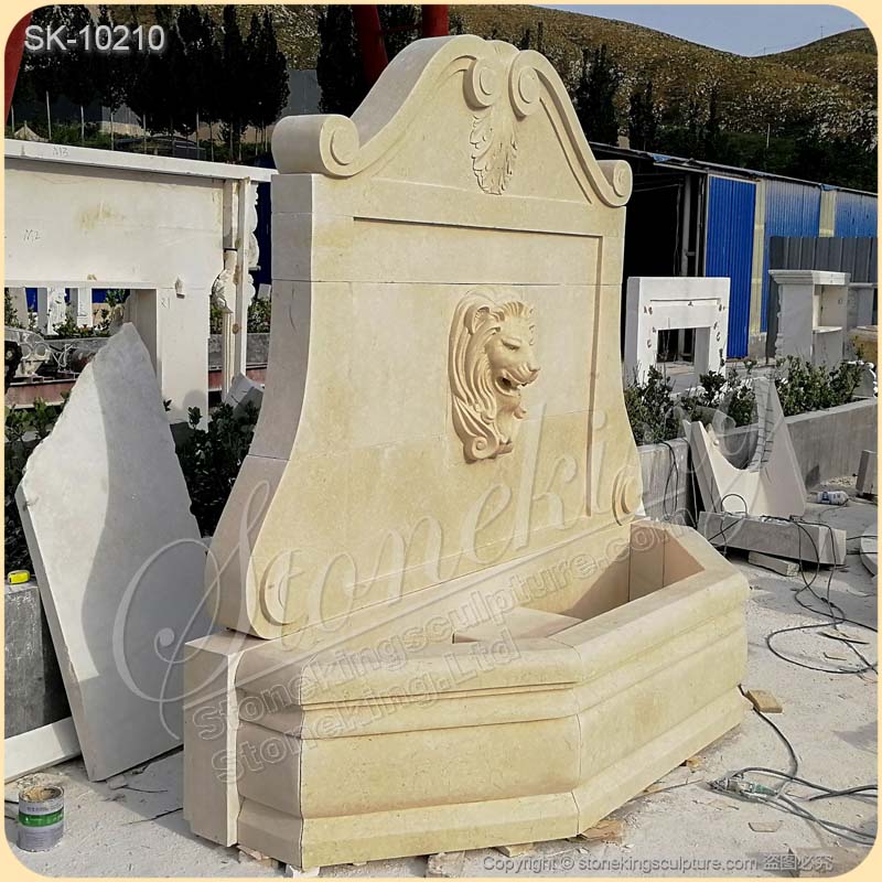 Factory Supplier Egyptian Beige Marble Outdoor Lion Head Wall Fountain for sale